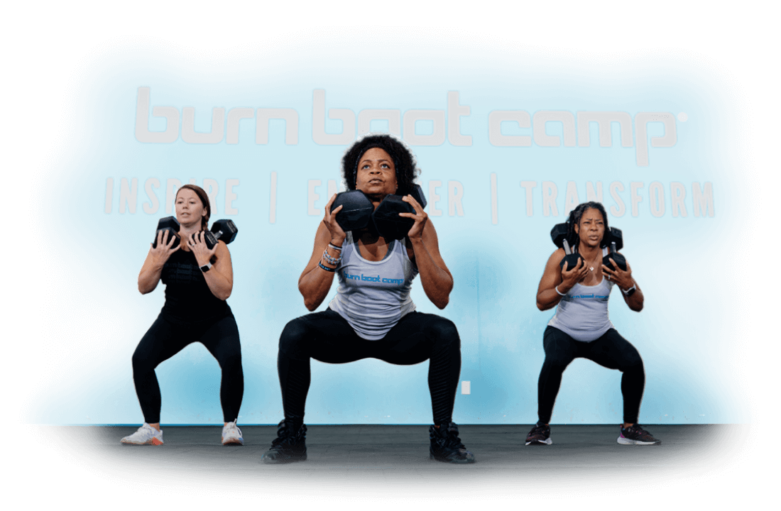 3 Woman doing squats with dumbbells on their shoulders